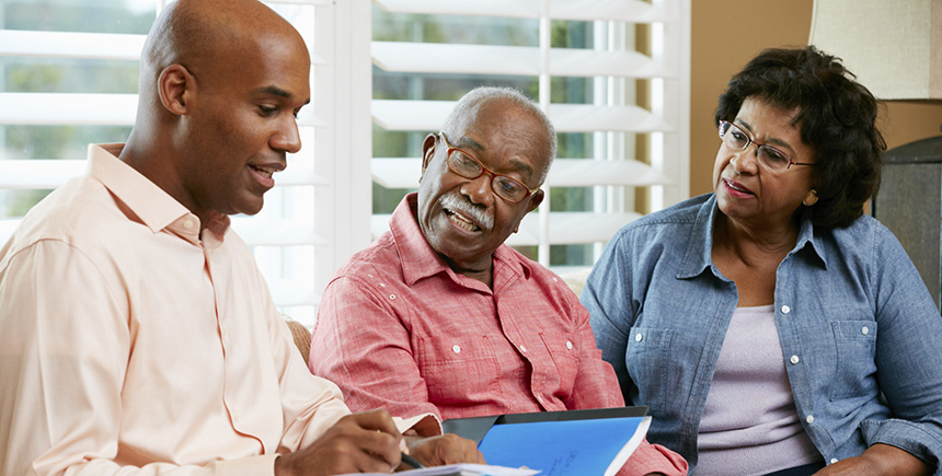 Elderly parents reviewing Trust with son